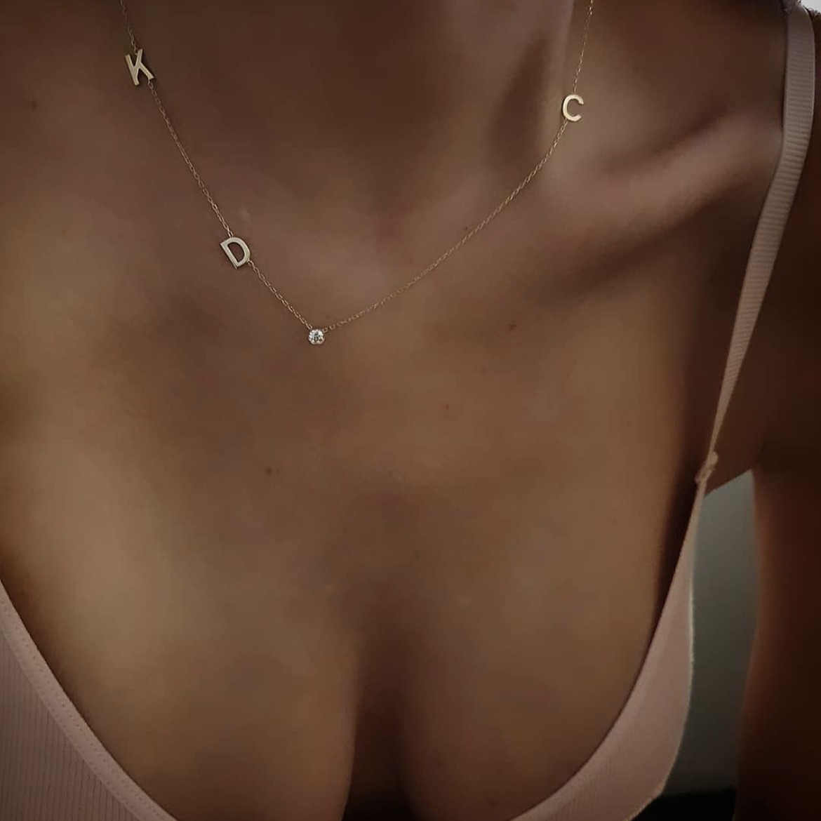 Златно колие с три букви и циркон