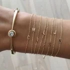 Златна гривна с буква 